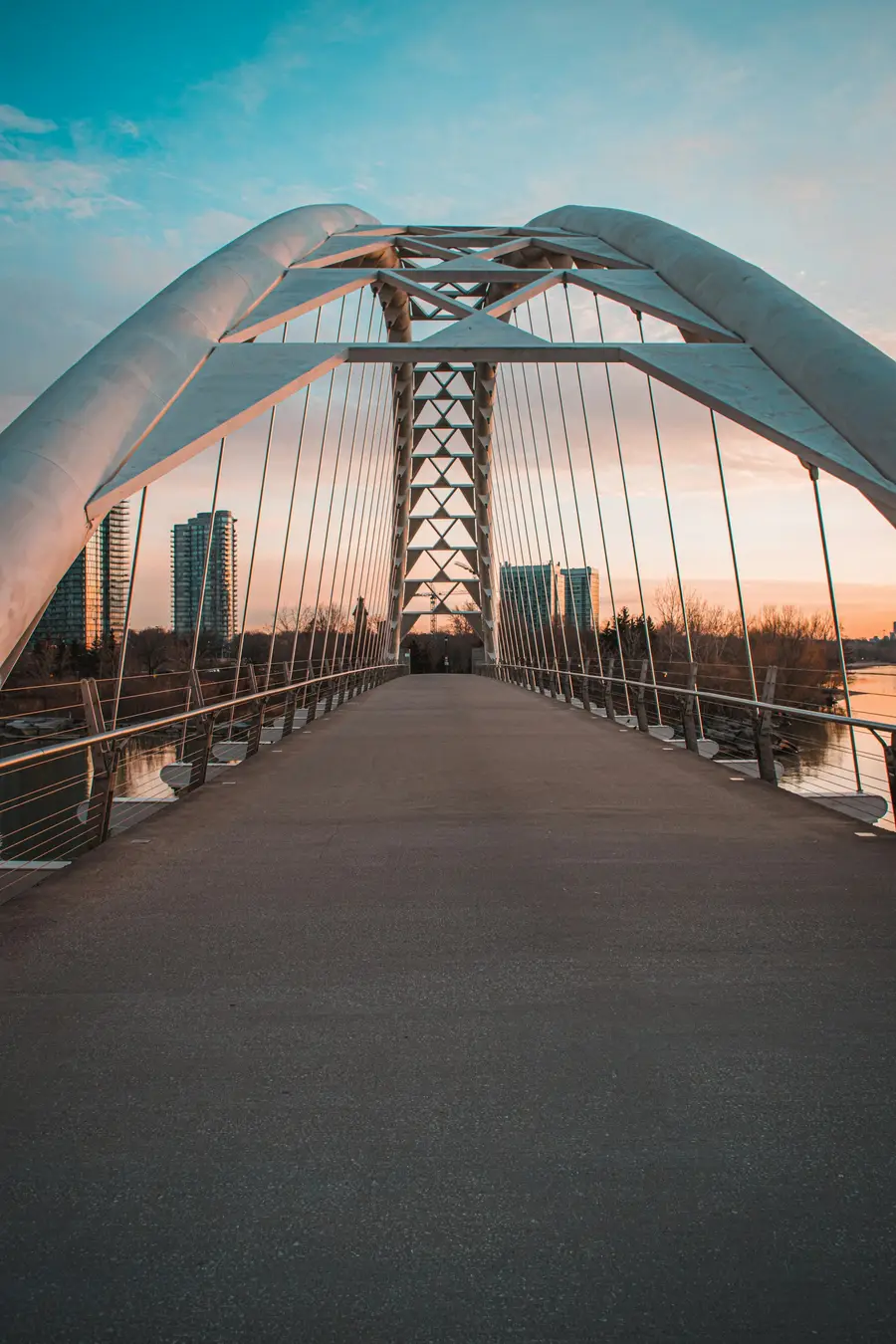 Walkway of the Humber Bay Arch Bridge at sunset